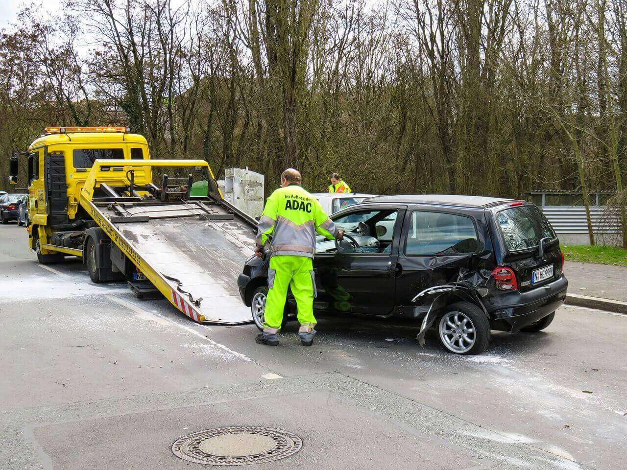 Car accident at fault car in a collision being towed