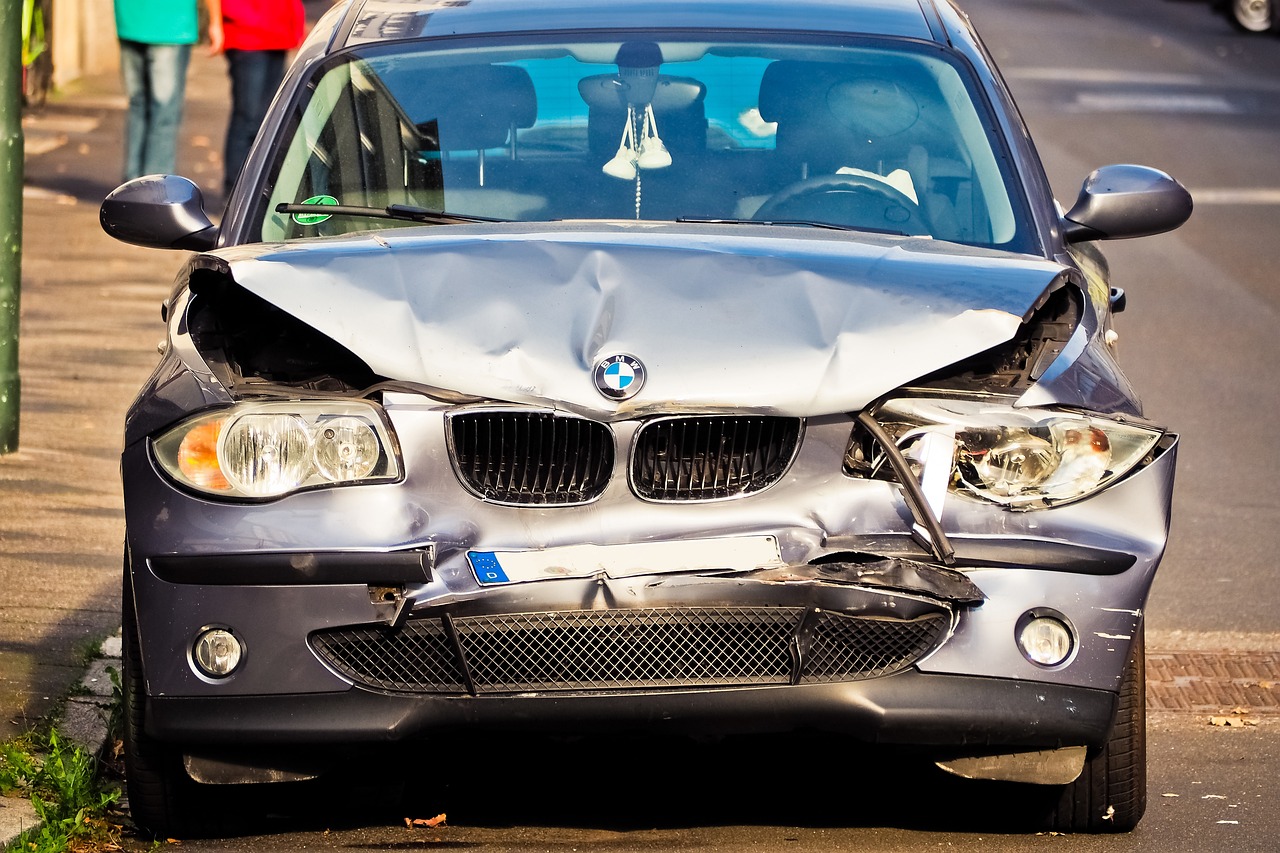 silver car with damaged front end